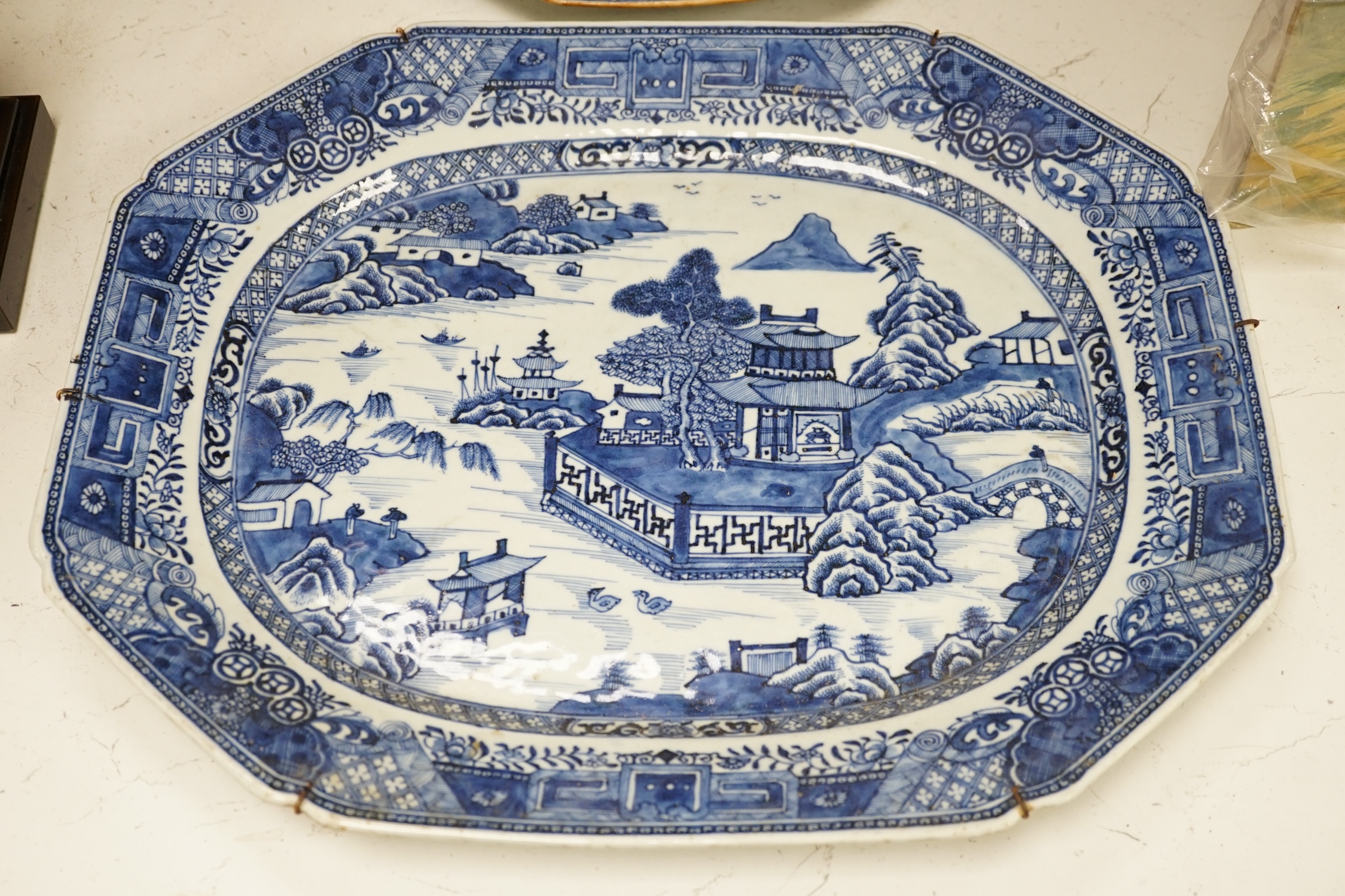 Two 18th century Chinese blue and white dishes, largest 44.5cm long. Condition - fair